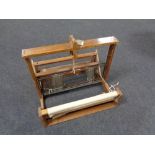 A table topped vintage weaving machine