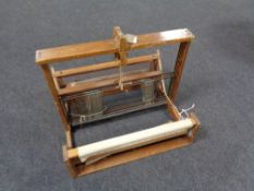 A table topped vintage weaving machine