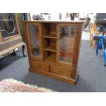 A Parker Knoll leaded glass door bookcase (a/f)