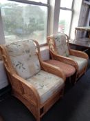 A pair of conservatory chairs and a small wicker low table