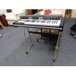 A mid century Avon rose-morris electric organ