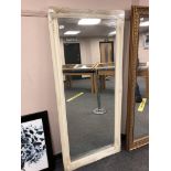 An ivory style swept frame mirror 75 cm x 167 cm.