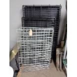 Three folding metal dog cages