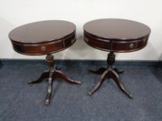 A pair of inlaid mahogany pedestal drum tables