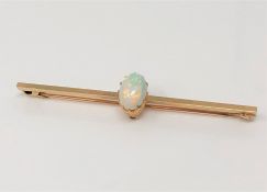 A yellow gold opal bar brooch