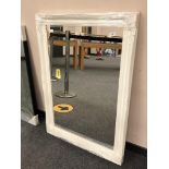 A contemporary white swept frame mirror 75 cm x 106 cm