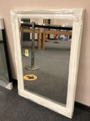 A contemporary white swept frame mirror 75 cm x 106 cm