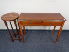 A mahogany effect two drawer hall table together with a plant stand
