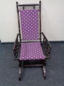 An American rocking chair in purple spotted fabric