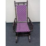 An American rocking chair in purple spotted fabric