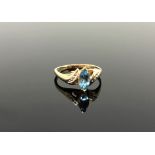 A 10ct gold topaz and diamond ring,