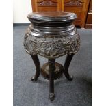 A circular Chinese style hardwood plant stand