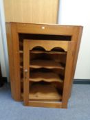 A nineteenth century pine corner cabinet