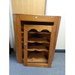 A nineteenth century pine corner cabinet