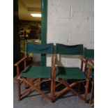 A pair of folding teak director's chairs