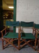 A pair of folding teak director's chairs