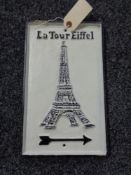 A metal Eiffel Tower plaque