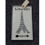 A metal Eiffel Tower plaque