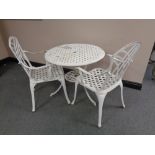 A painted aluminium patio table and two armchairs