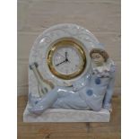 A Lladro figural mantel clock