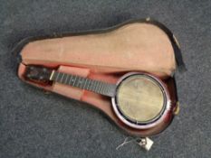 A Keech banjolele in case