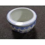 A Chinese blue and white glazed fish bowl planter