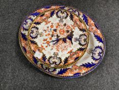 Eight antique Imari patterned plates together with matching meat plate
