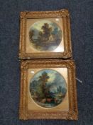 A pair of antiquarian gilt framed oil paintings - figures by a river with dwellings beyond (2)