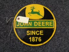 A metal John Deere plaque