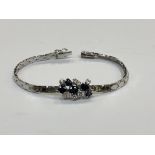 An 18ct white gold sapphire and diamond bracelet, approximately 1ct of diamonds, length 17.5cm.