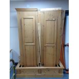 A triple door pine wardrobe fitted with two drawers (dismantled)