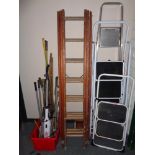 A wooden triple section extension ladder