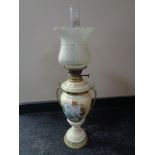 A 19th century ceramic and glass oil lamp