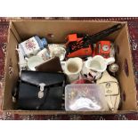 A box of various china, tub of costume jewellery, die cast crane.