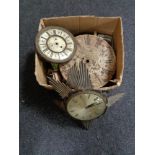 A box of antique and later clock faces and movements