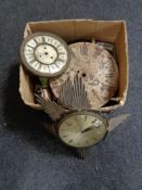 A box of antique and later clock faces and movements