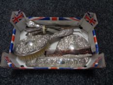 A box of four piece silver backed dressing table set together with a bundle of silver handled