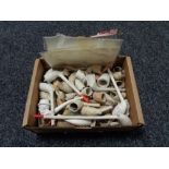 A box of antique clay pipes