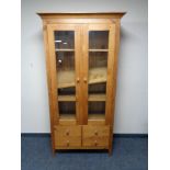 A pine double door bookcase