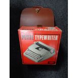 A leather cased typewriter,