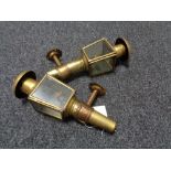 A pair of antique brass coach lights