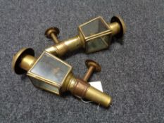 A pair of antique brass coach lights