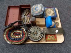 A tray of vintage cash box and tins, beaded purse, bullet casings, costume jewellery,