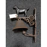 A metal Labrador wall bracket with bell