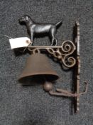 A metal Labrador wall bracket with bell