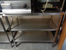 A stainless steel three tier prep table