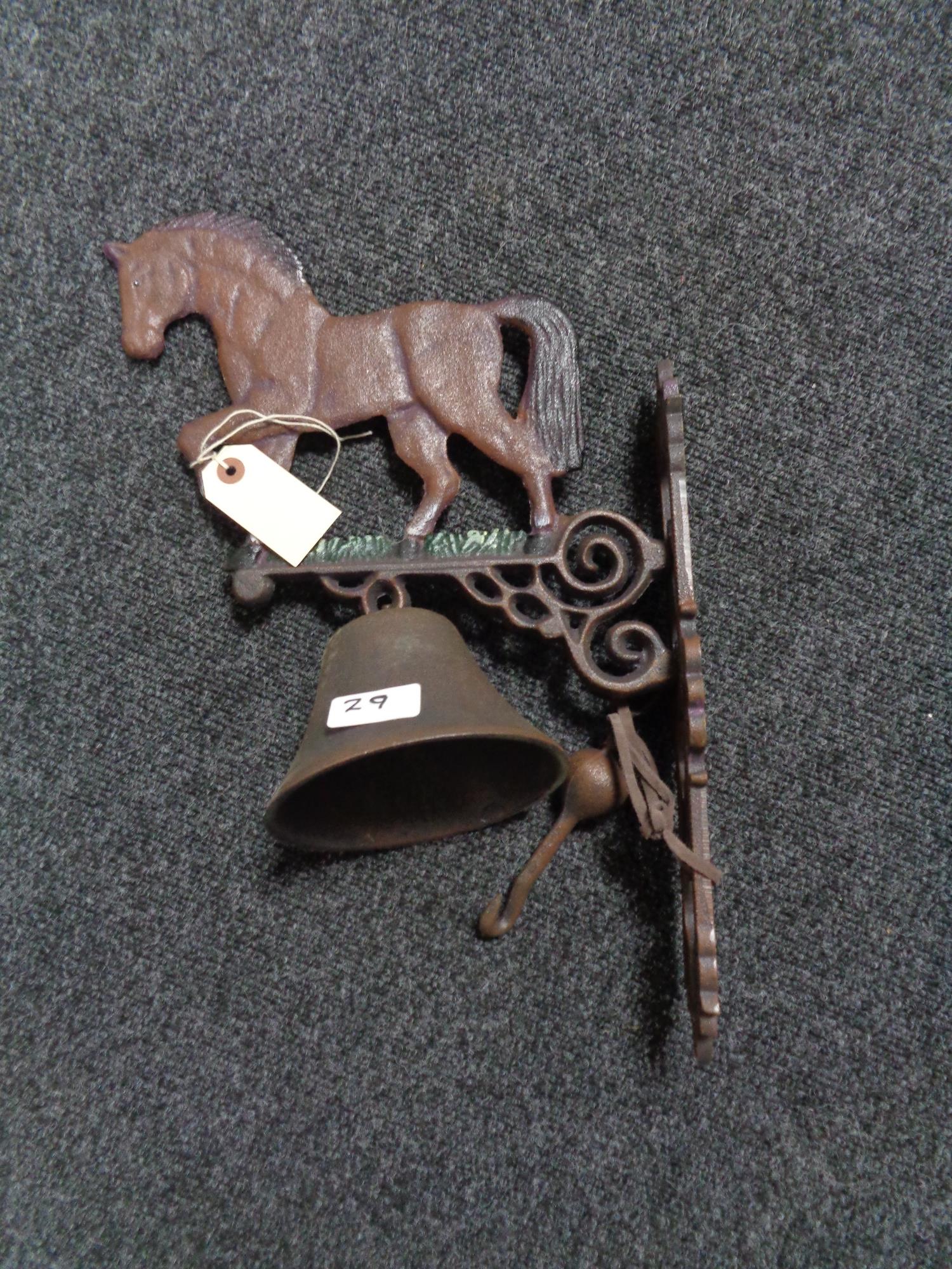 A metal Horse bracket with bell