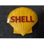 A metal Shell logo plaque