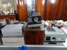 Four vintage projectors to include a Rank Albus in fitted wooden box, Prinz Auto,