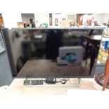 A Sony Bravia KDL-40 WE663 tv with lead and remote